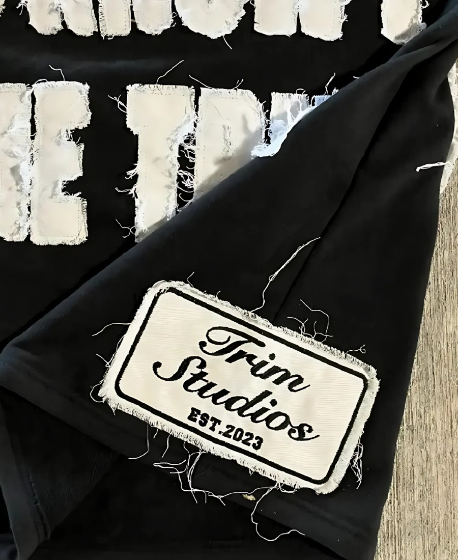 003 Trim Studios Tee