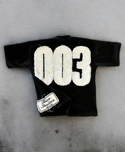003 Trim Studios Tee